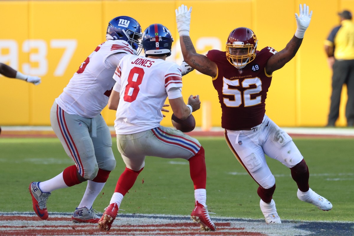 Nov 8, 2020; Landover, Maryland, USA; New York Giants quarterback Daniel Jones (8) fumbles the ball under pressure from Washington Football Team outside linebacker Ryan Anderson (52) in the fourth quarter at FedExField.