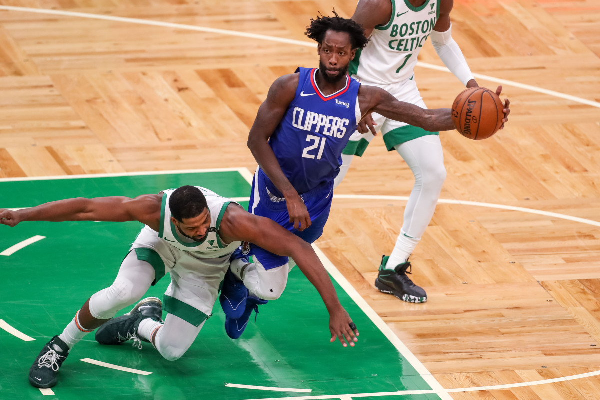 Mar 2, 2021; Boston, Massachusetts, USA; Los Angeles Clippers guard Patrick Beverley (21) passes the ball during the second half against the Boston Celtics at TD Garden. Mandatory Credit: Paul Rutherford-USA TODAY Sports