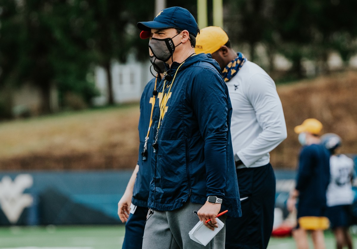 West Virginia head coach Neal Brown looking over the first day of the 2021 spring practice period.