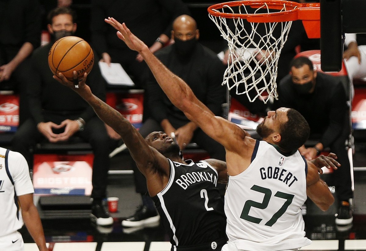 Rudy Gobert (27) goes for a block against the Brooklyn Nets