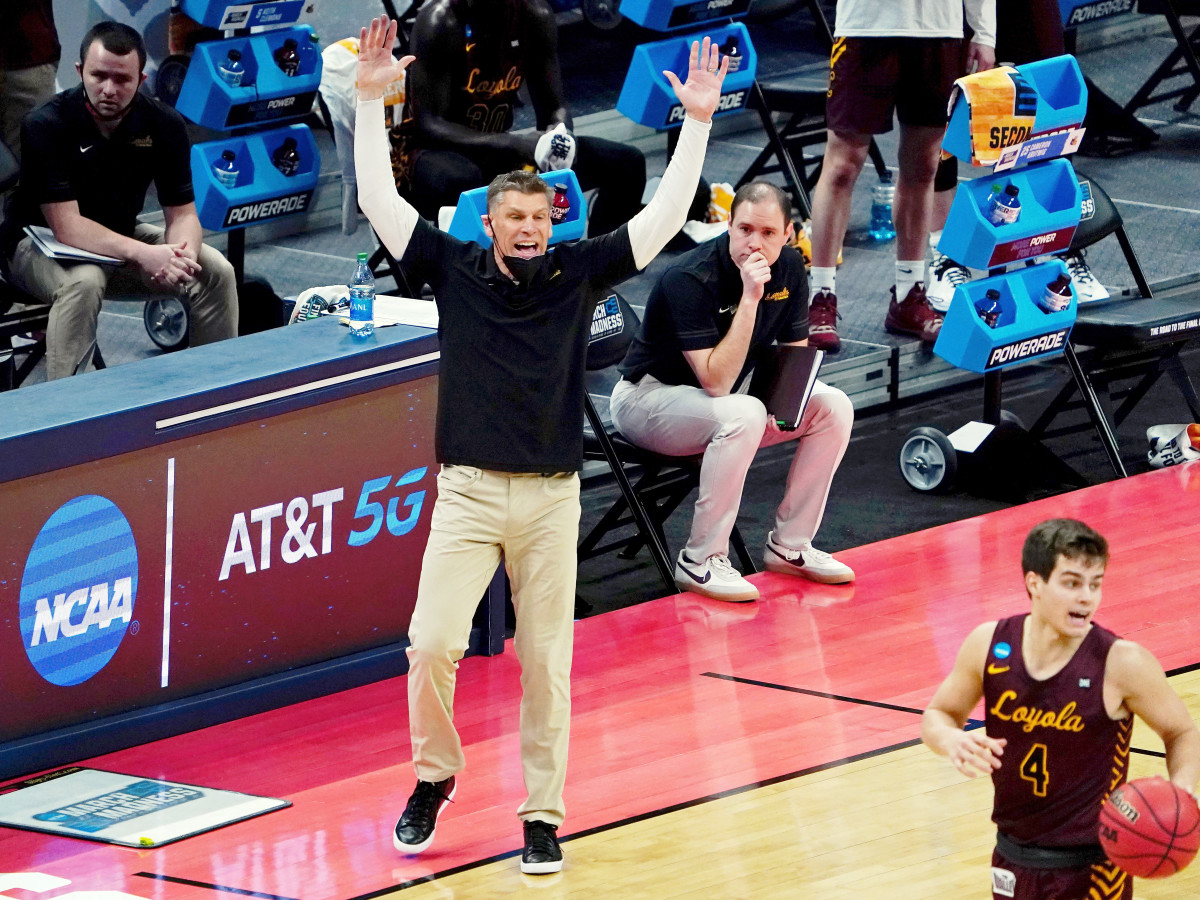 Mar 21, 2021; Indianapolis, Indiana, USA; Loyola Ramblers head coach Porter Moser reacts as guard Braden Norris (4) dribbles the ball against the Illinois Fighting Illini during the first half in the second round of the 2021 NCAA Tournament at Bankers Life Fieldhouse.