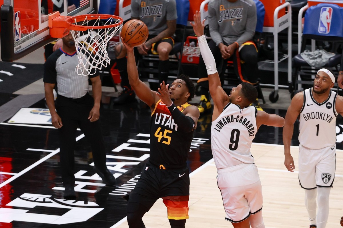 Donovan Mitchell (45) scores a layup in the Utah Jazz win over the Brooklyn Nets on Wednesday night.