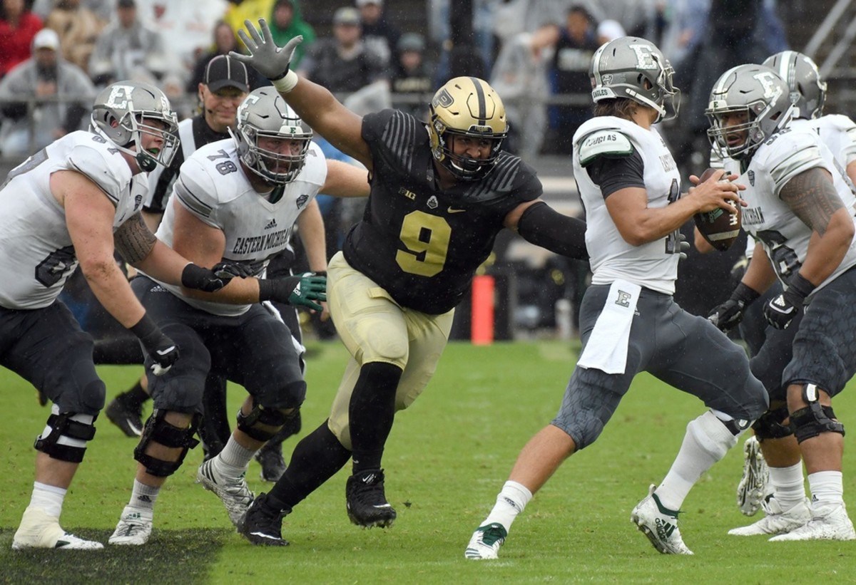 Purdue's Lorenzo Neal sacks Eastern Michigan's Tyler Wiegers© Frank Oliver for the Journal & Courier 