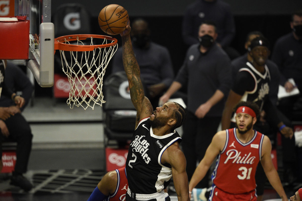 Mar 27, 2021; Los Angeles, California, USA; LA Clippers forward Kawhi Leonard (2) dunks the ball during the first half against the Philadelphia 76ers at Staples Center. Mandatory Credit: Kelvin Kuo-USA TODAY Sports