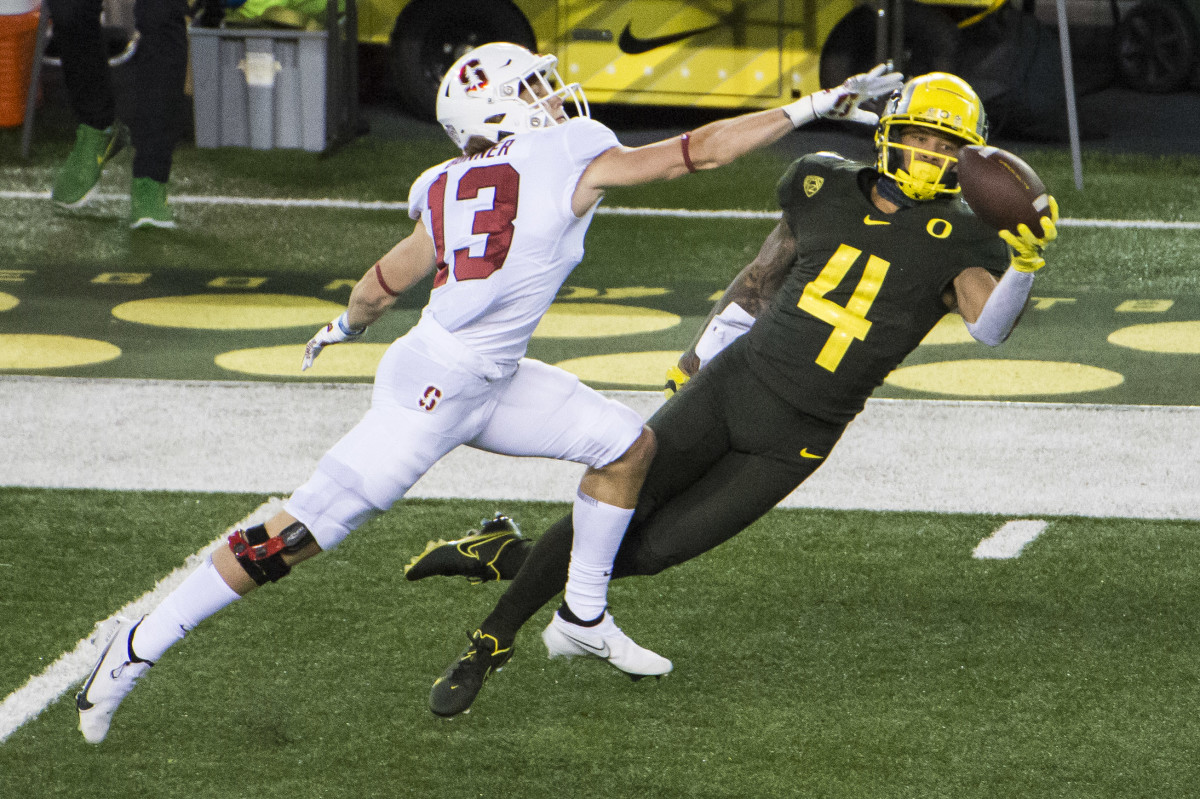 Mycah Pittman extends for a one-handed grab as Stanford defensive back Ethan Bonner defends at Autzen Stadium on November 7, 2020.
