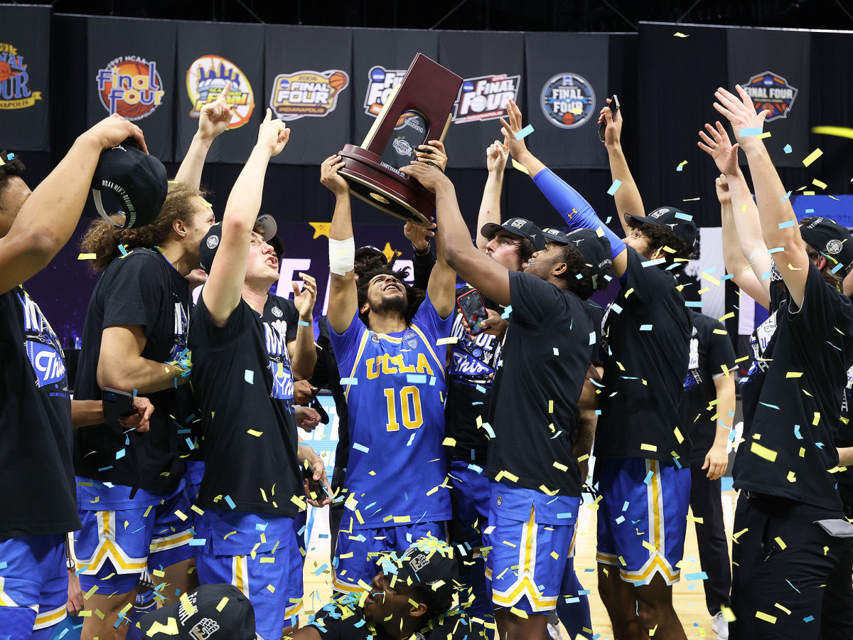 UCLA celebrates with its East Region trophy