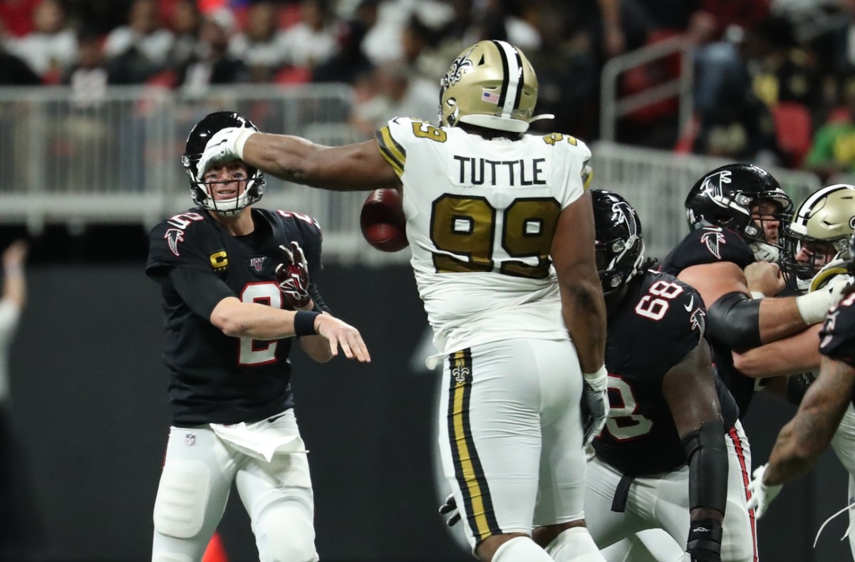 Nov 28, 2019; Falcons quarterback Matt Ryan (2) throws an interception to Saints defensive tackle Shy Tuttle (99). Mandatory Credit: Jason Getz-USA TODAY 