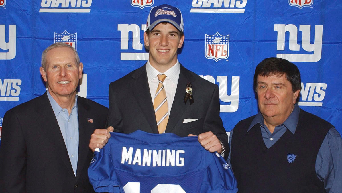 On Draft Day 2004, Accorsi (right) swung a deal for Manning, giving Coughlin a franchise QB.