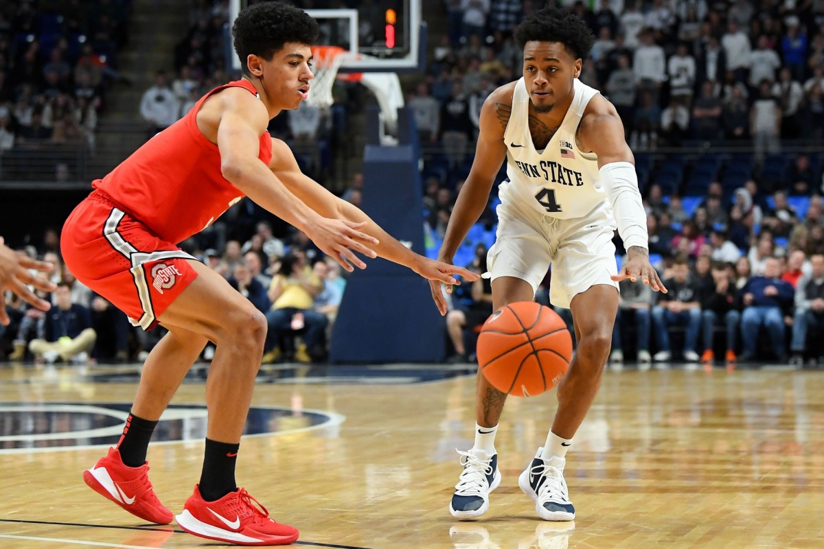 Penn State Nittany Lions guard Curtis Jones (4) passes the ball around Ohio State Buckeyes guard D.J. Carton (left) during the first half at the Bryce Jordan Center. Mandatory Credit: Rich Barnes-USA TODAY Sports