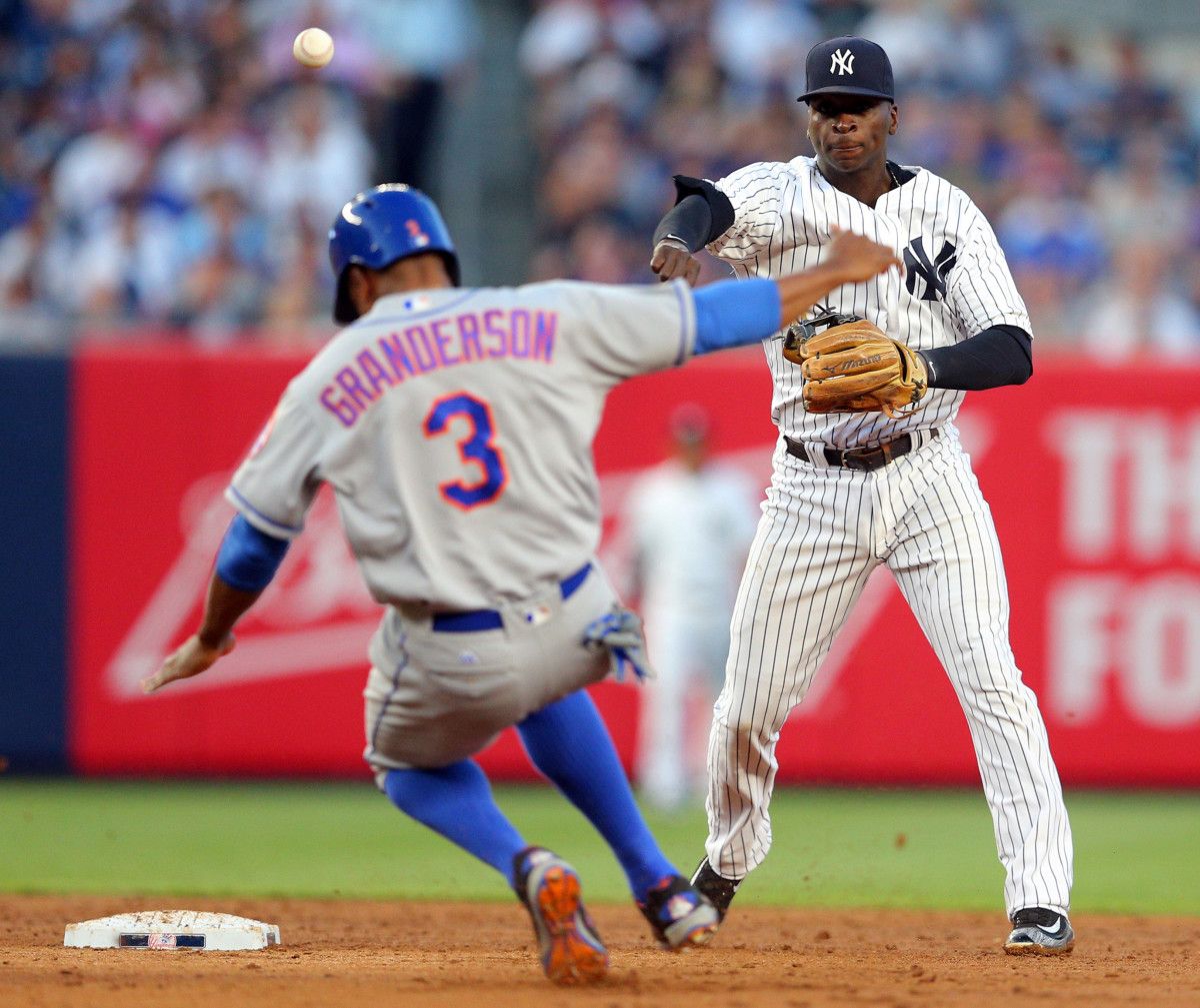 Curtis Granderson slides into Didi Gregorius