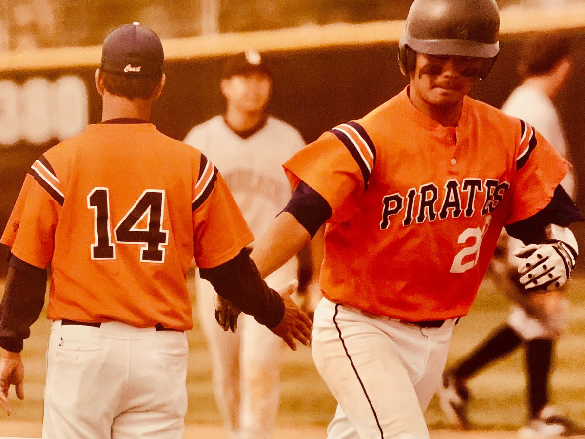 Jourdan Watanabe (right) slapping hands with John Altobelli (left)