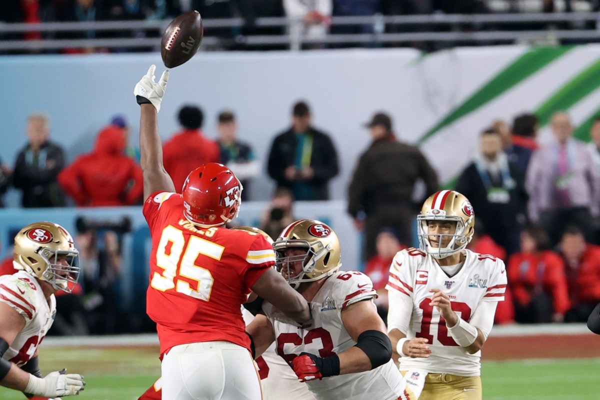 Kansas City Chiefs defensive end Chris Jones (95) knocks down a pass from San Francisco 49ers quarterback Jimmy Garoppolo (10) during the fourth quarter in Super Bowl LIV at Hard Rock Stadium.
