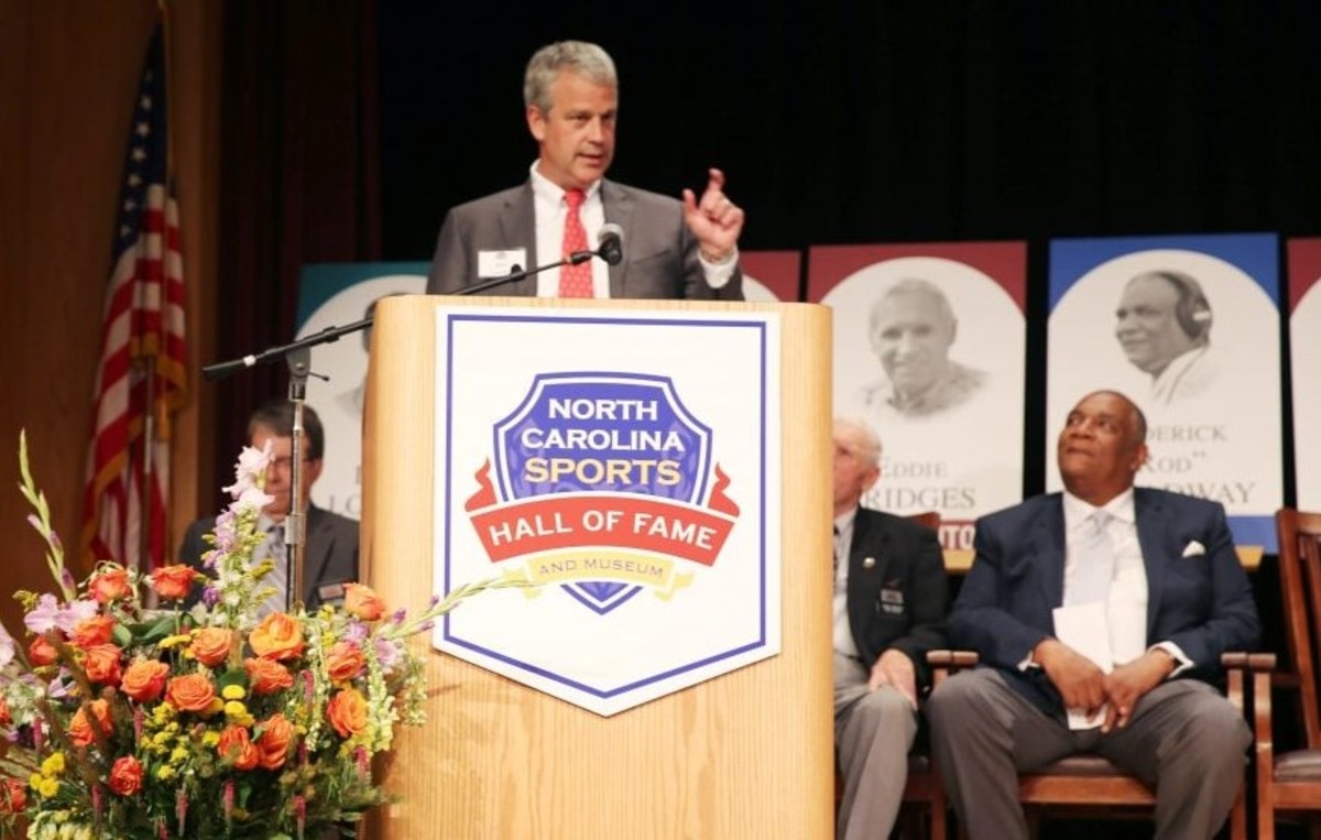 NC State AD Boo Corrigan accepts his father Gene's induction into the NC Sports Hall of Fame last summer