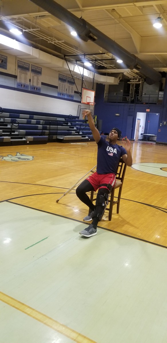 M.J. Rice shoots jump shots despite being in a cast.