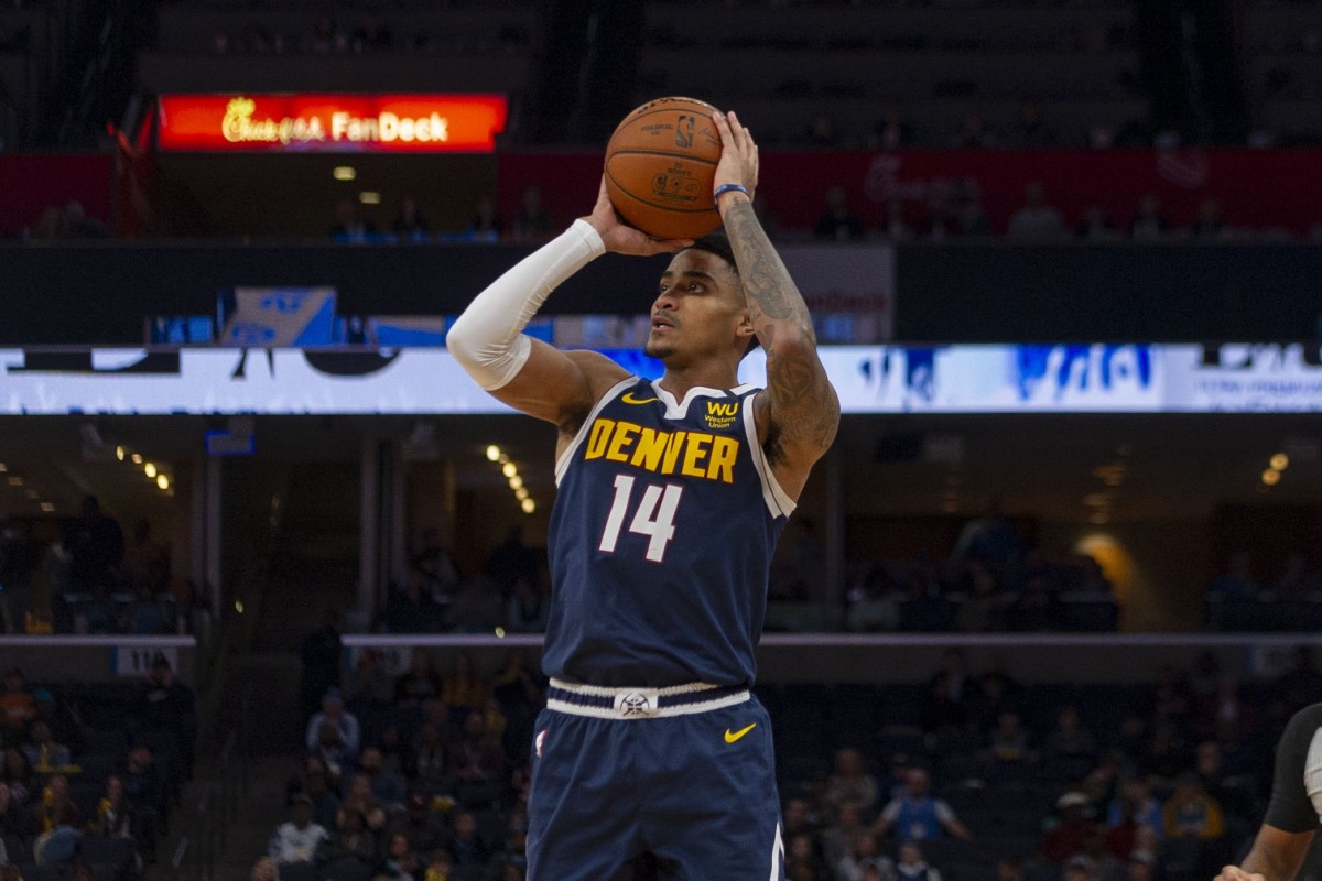 Nuggets shooting guard Gary Harris goes up for a shot in a game against the Grizzlies.