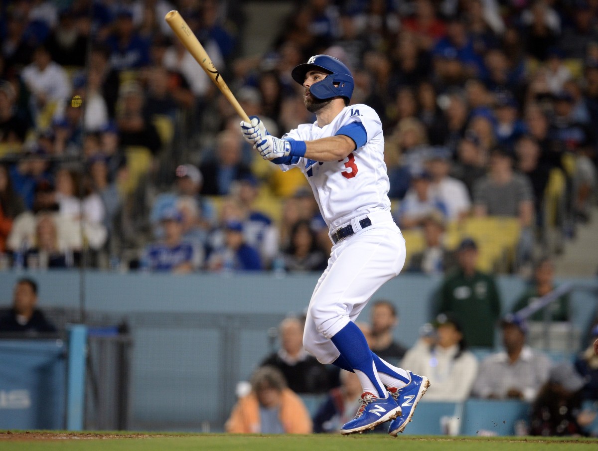 June 19, 2019; Los Angeles, CA, USA; Los Angeles Dodgers shortstop Chris Taylor (3) hits a solo home run against the San Francisco Giants during the fifth inning at Dodger Stadium.