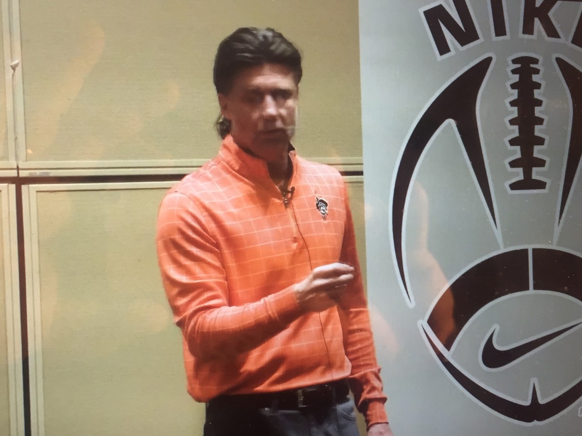 Gundy speaking in Las Vegas at the Nike Football Coaches Clinic.