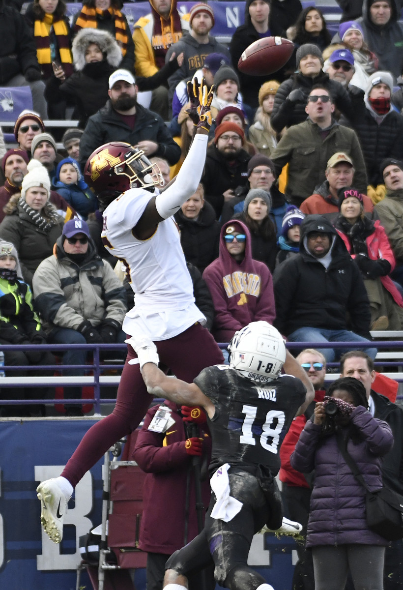 Nov 23, 2019; Evanston, IL, USA; Minnesota Golden Gophers wide receiver Tyler Johnson (6) catches a touchdown as Northwestern Wildcats defensive back Cameron Ruiz (18) defends him during the second half at Ryan Field. Mandatory Credit: David Banks-USA TODAY Sports