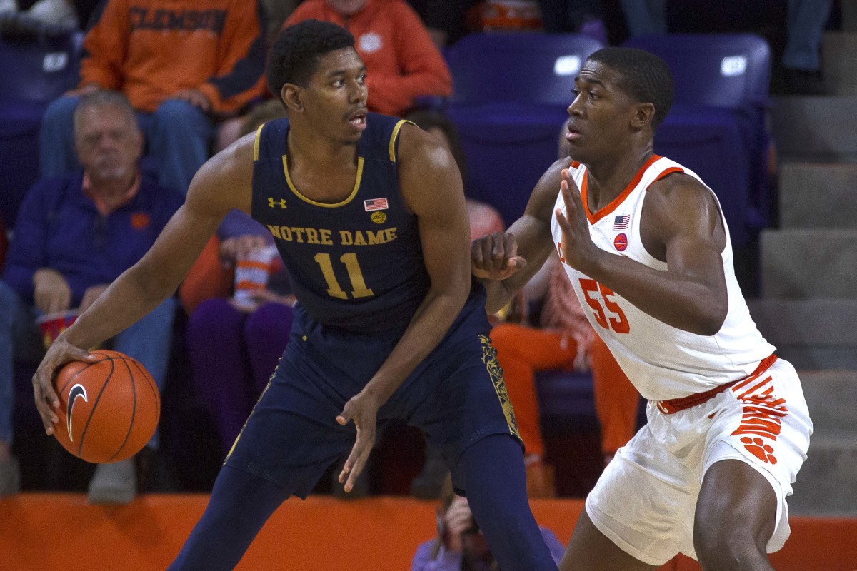 Notre Dame Fighting Irish forward Juwan Durham (11) attempts to drive to the basket while being defended by Clemson Tigers center Trey Jemison (55) during the first half of the game at Littlejohn Coliseum on Feb. 9.