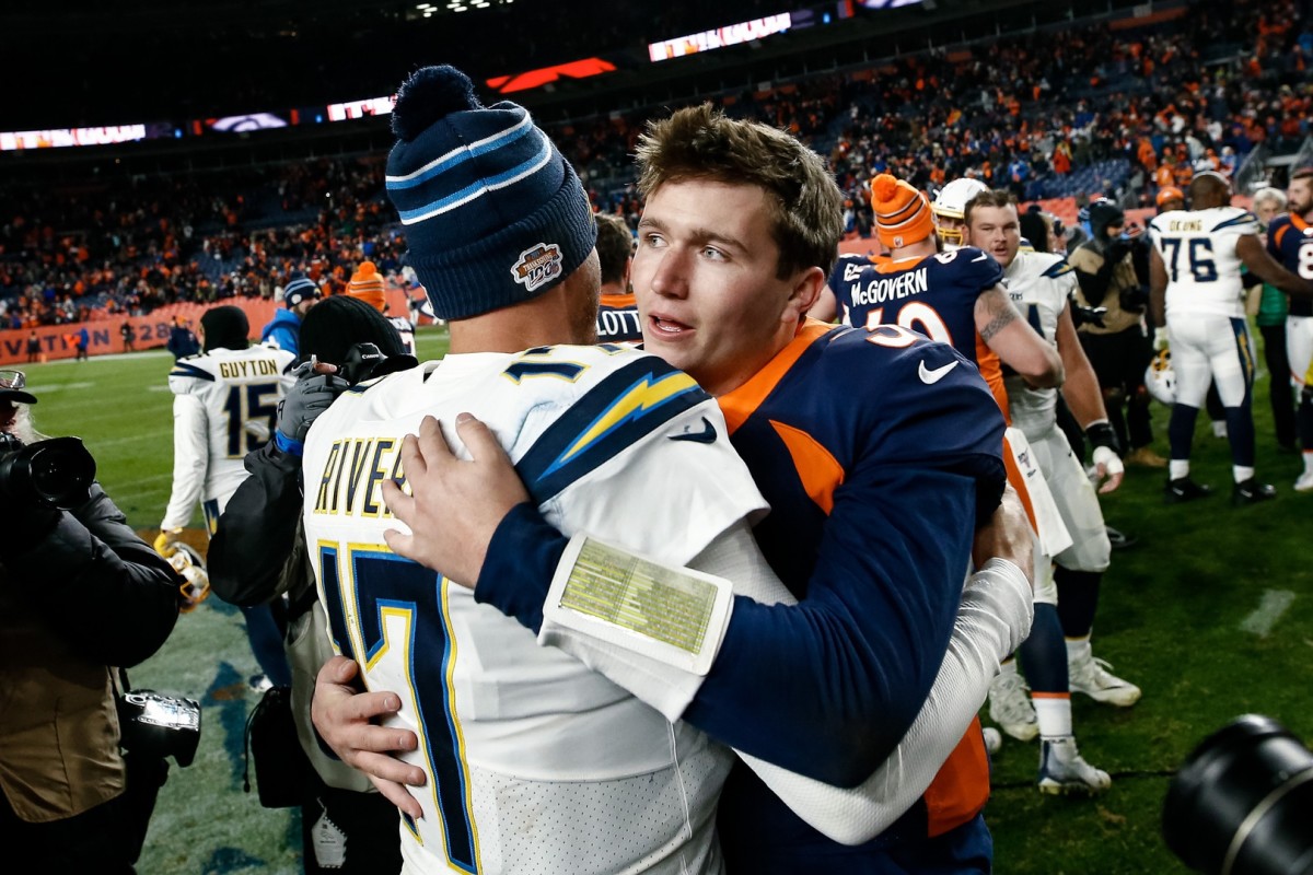 Denver Broncos quarterback Drew Lock (3) greets Los Angeles Chargers quarterback Philip Rivers (17) after the game at Empower Field at Mile High.