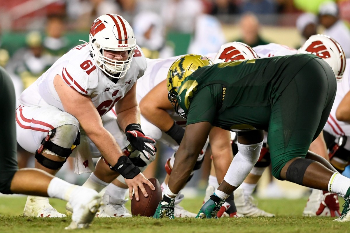 Aug 30, 2019; Tampa, FL, USA; Wisconsin Badgers offensive lineman Tyler Biadasz (61) looks to snap the ball during the second half against the South Florida Bulls at Raymond James Stadium.
