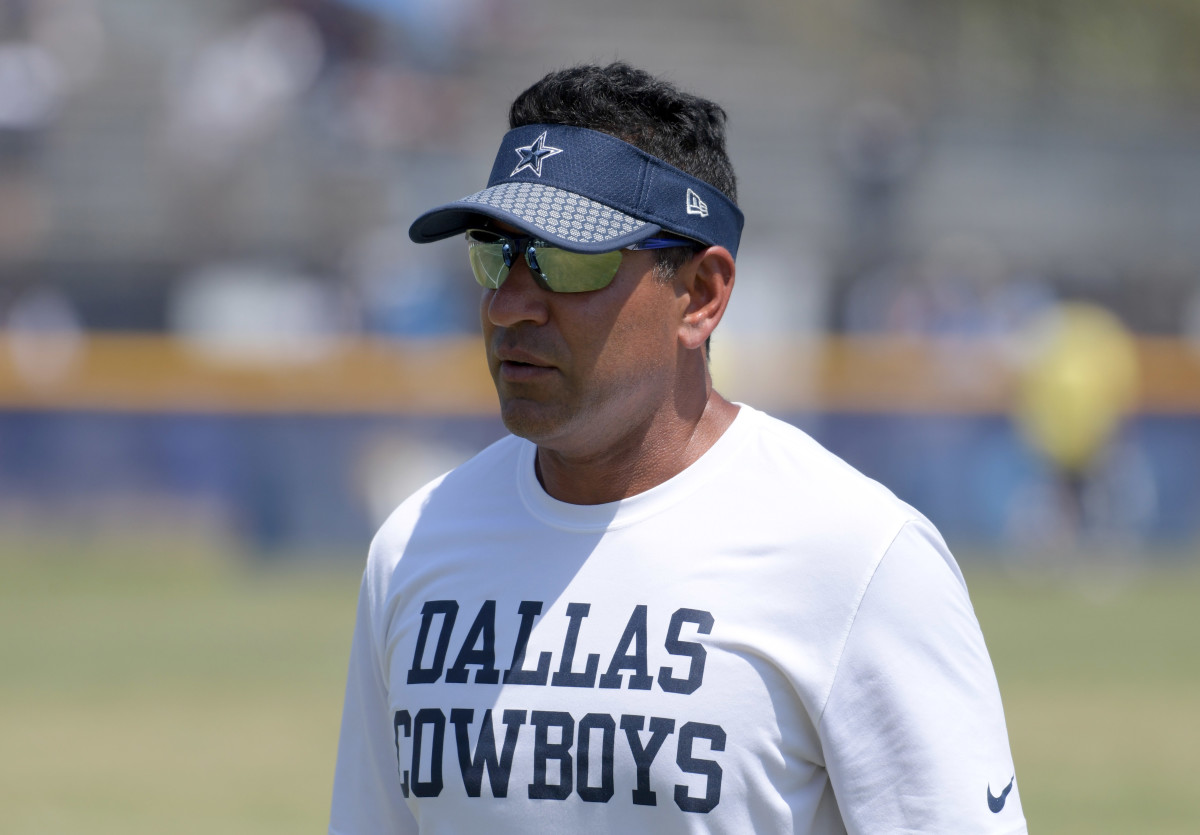 Dallas Cowboys receivers coach Sanjay Lal reacts during training camp at River Ridge Fields.