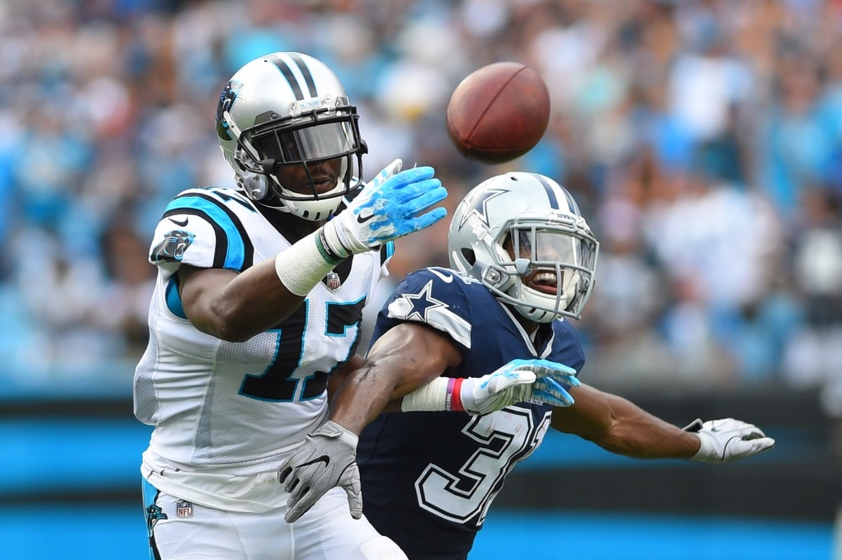 Carolina Panthers wide receiver Devin Funchess (17) and Dallas Cowboys cornerback Byron Jones (31) fight for the ball in the first half at Bank of America Stadium.