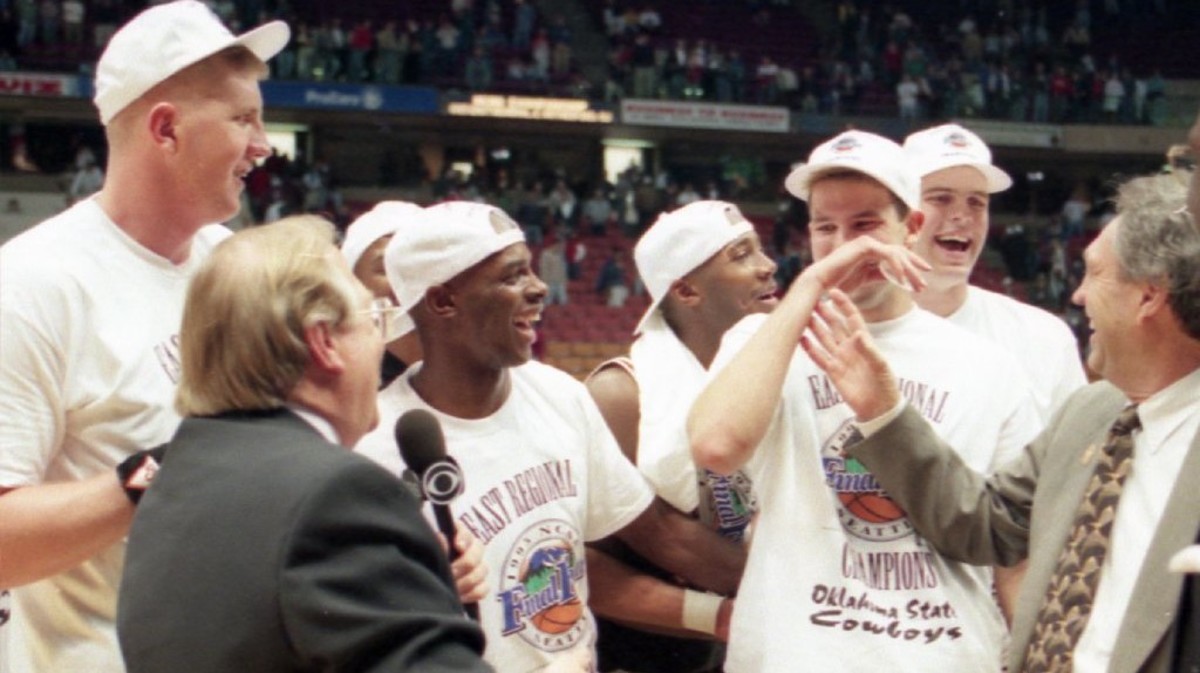 Pierce, just to the left of Eddie Sutton in the picture laughs after accidentally spitting on Verne Lundquist of CBS during an interview after earning the Final Four trip beating UMass. 