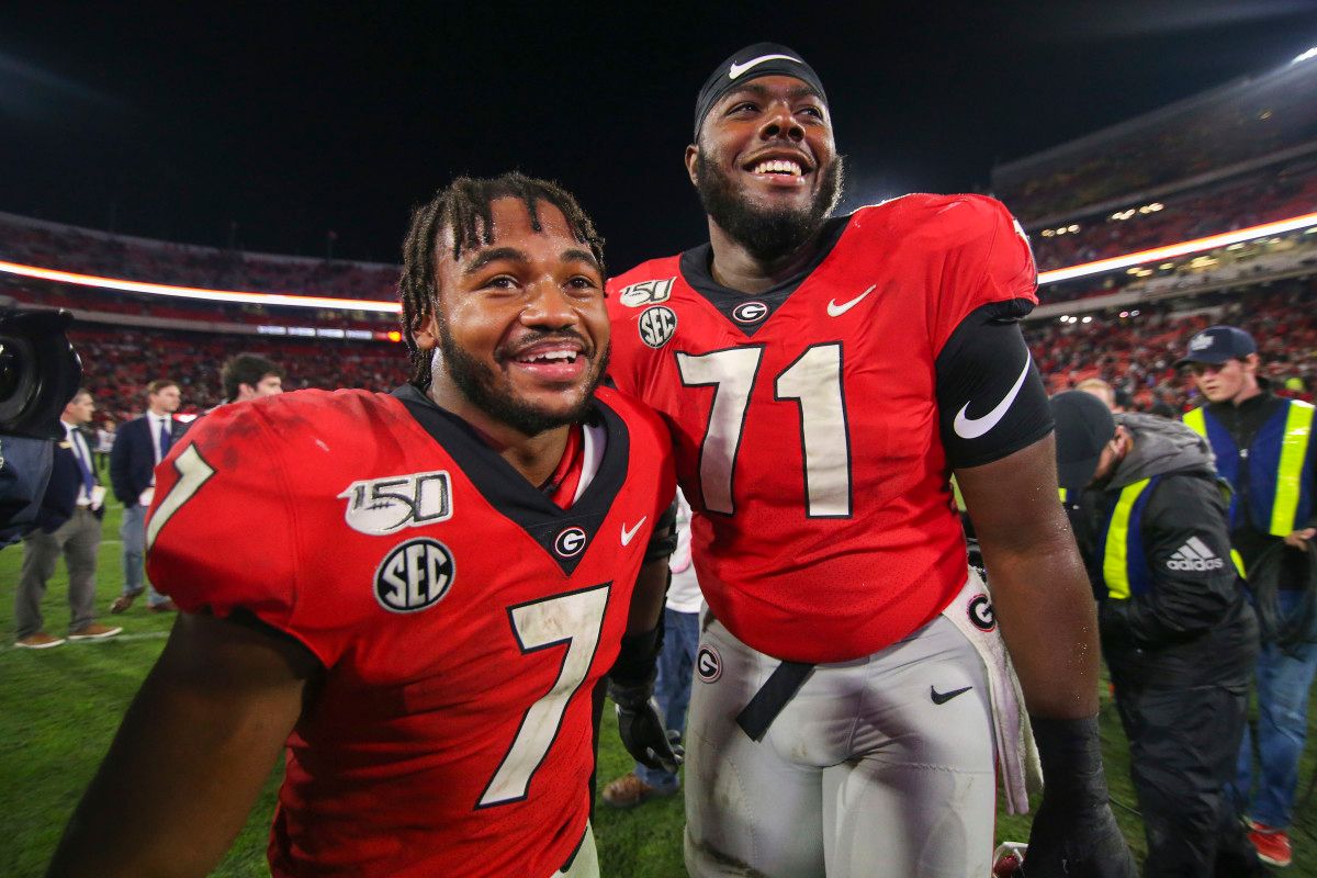 OT, Andrew Thomas with RB, D'Andre Swift