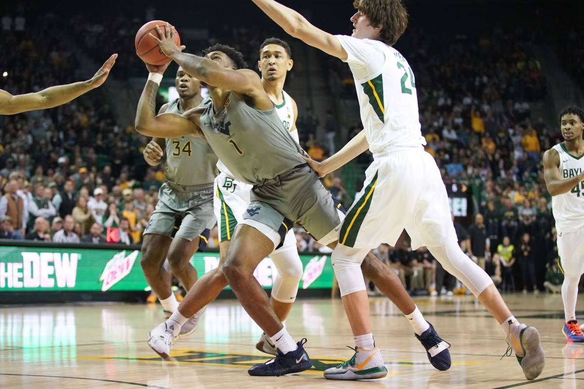 West Virginia Mountaineers forward Derek Culver (1) takes a shot against Baylor Bears guard Matthew Mayer (24) during the first half at Ferrell Center.