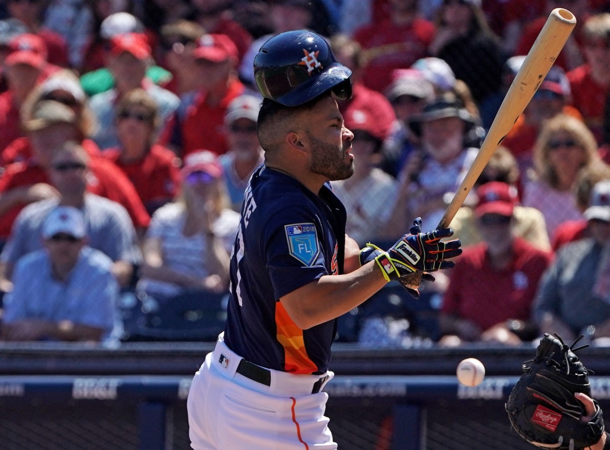 Mar 14, 2018; West Palm Beach, FL, USA; Houston Astros designated hitter Jose Altuve (27) is hit by the pitch in the first inning during a spring training game against the St. Louis Cardinals at The Ballpark of the Palm Beaches. Mandatory Credit: Jasen Vinlove-USA TODAY Sports
