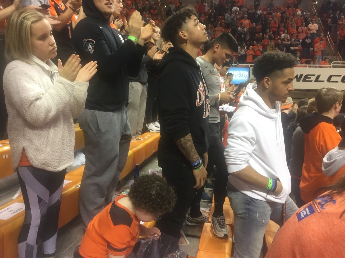 Tracin and Tylan Wallace watching the final moments of the Coaches vs. Cancer  by the Cowboys over Texas Tech.