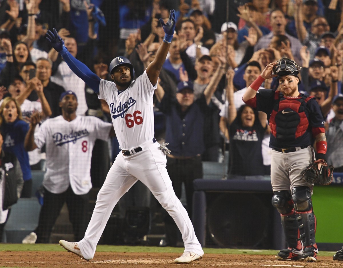 Oct 27, 2018; Los Angeles, CA, USA; Los Angeles Dodgers outfielder Yasiel Puig (66) celebrates after hitting a three-run home run against the Boston Red Sox in the sixth inning in game four of the 2018 World Series at Dodger Stadium. Mandatory Credit: Robert Hanashiro-USA TODAY Sports