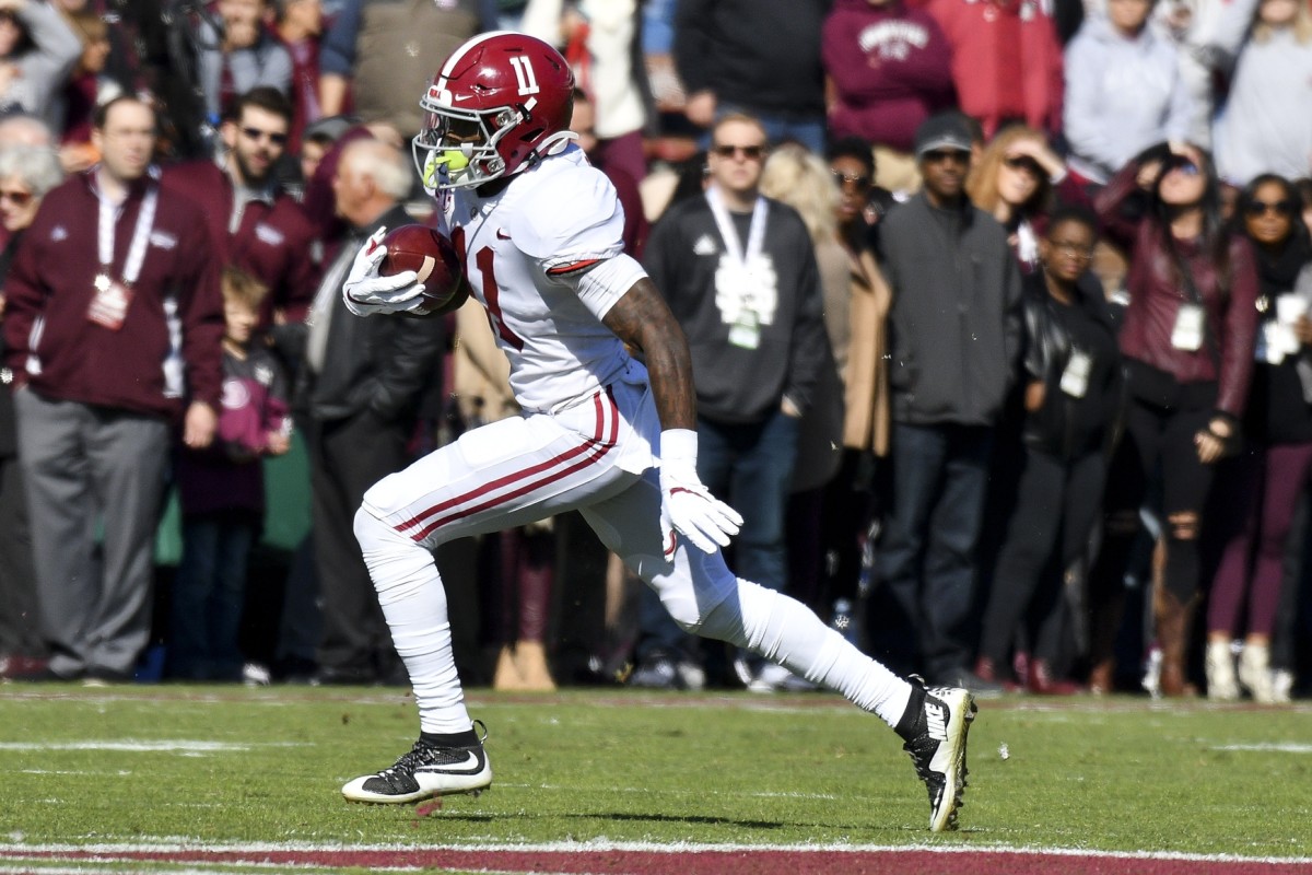 Nov 16, 2019; Starkville, MS, USA; Alabama Crimson Tide wide receiver Henry Ruggs III (11) runs the ball against the Mississippi State Bulldogs during the first quarter at Davis Wade Stadium. Mandatory Credit: Matt Bush-USA TODAY Sports
