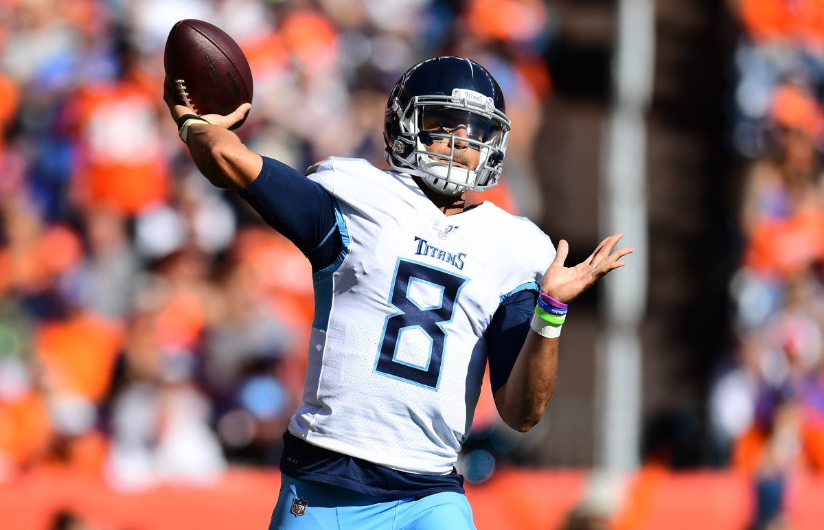 Oct 13, 2019; Denver, CO, USA; Tennessee Titans quarterback Marcus Mariota (8) passes the ball in the first quarter against the Denver Broncos at Empower Field at Mile High. Mandatory Credit: Ron Chenoy-USA TODAY Sports