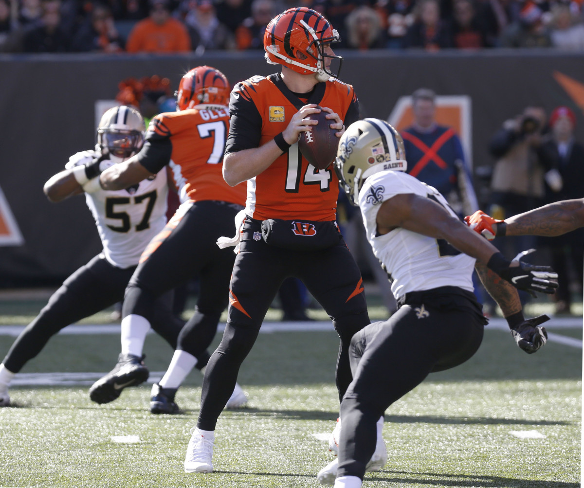 Nov 11, 2018; Cincinnati, OH, USA; Cincinnati Bengals quarterback Andy Dalton (14) looks to throw under pressure against the New Orleans Saints during the first half at Paul Brown Stadium. Mandatory Cr