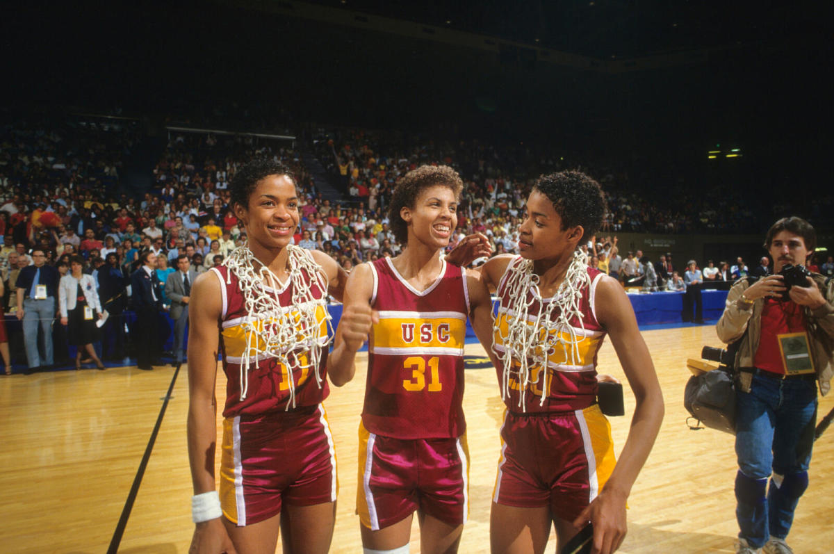 Miller, flanked by teammates Paula (left) and Pam McGee, won two national championships with USC.