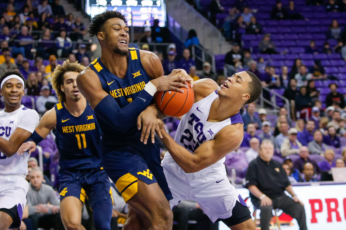 West Virginia Mountaineers forward Derek Culver (1) and TCU Horned Frogs forward Jaedon LeDee (23) fight for a rebound during the first half at Ed and Rae Schollmaier Arena.