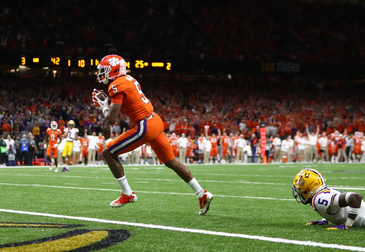 Jan 13, 2020; New Orleans, Louisiana, USA; Clemson Tigers wide receiver Tee Higgins (5) scores a touchdown in the College Football Playoff national championship game against the LSU Tigers at Mercedes-Benz Superdome.