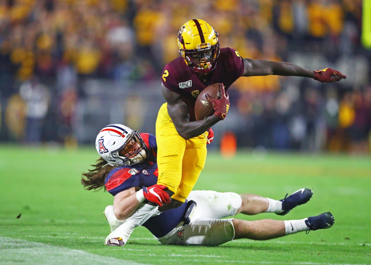 Nov 30, 2019; Tempe, AZ, USA; Arizona State Sun Devils wide receiver Brandon Aiyuk (2) is tackled by Arizona Wildcats linebacker Colin Schooler during the first half of the Territorial Cup at Sun Devil Stadium.