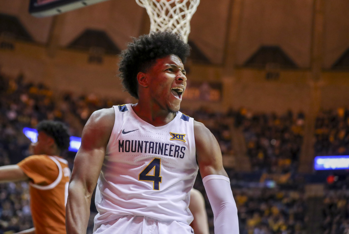 West Virginia Mountaineers guard Miles McBride (4) celebrates after a dunk during the second half against the Texas Longhorns at WVU Coliseum.