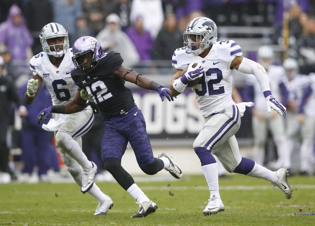 Dec 3, 2016; Fort Worth, TX, USA; Kansas State Wildcats running back Justin Silmon (32) carries the ball past TCU Horned Frogs cornerback Jeff Gladney (12) during the first half of an NCAA football game at Amon G. Carter Stadium.