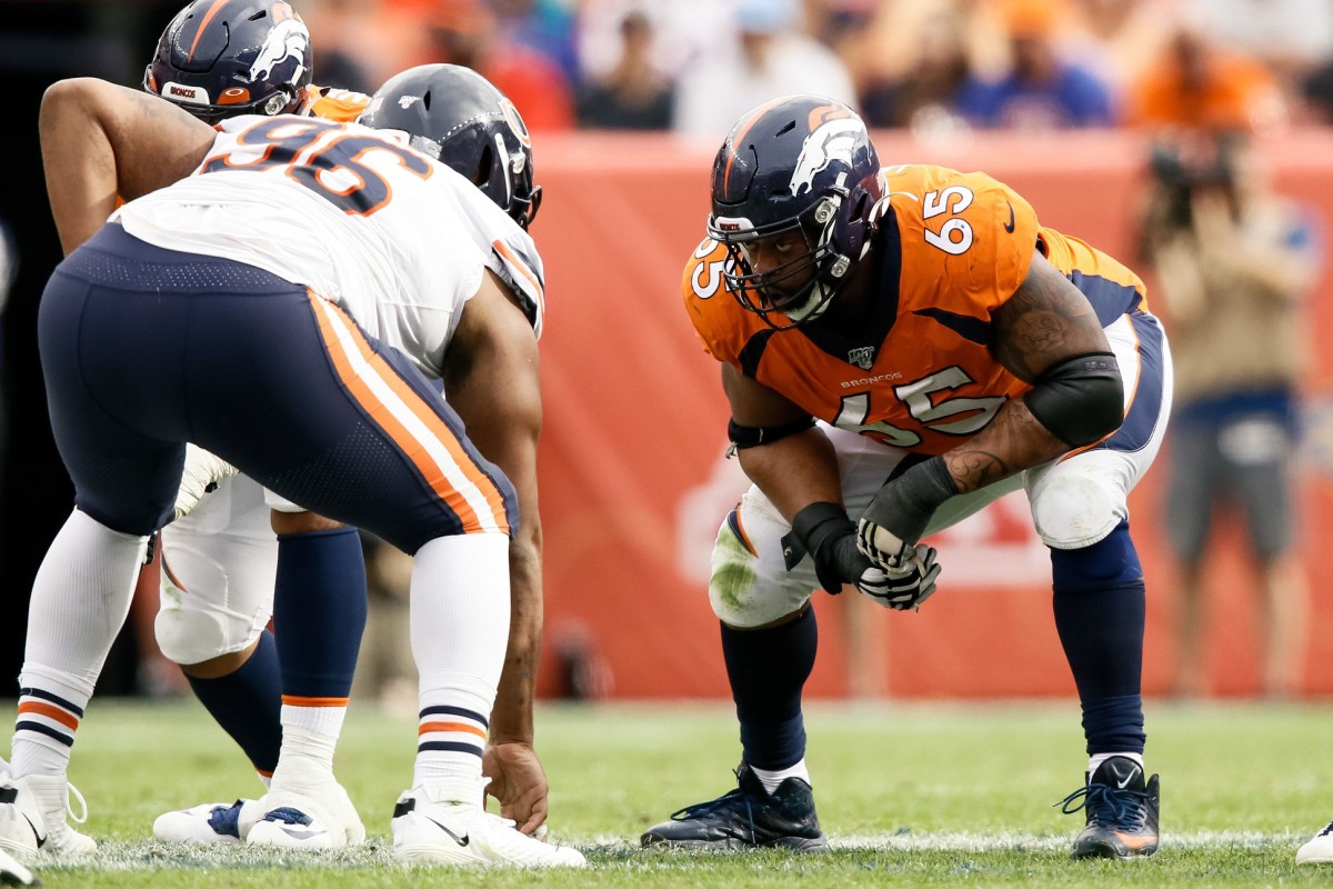 Denver Broncos guard Ronald Leary (65) lines up against Chicago Bears defensive tackle Akiem Hicks (96) in the fourth quarter at Empower Field at Mile High.