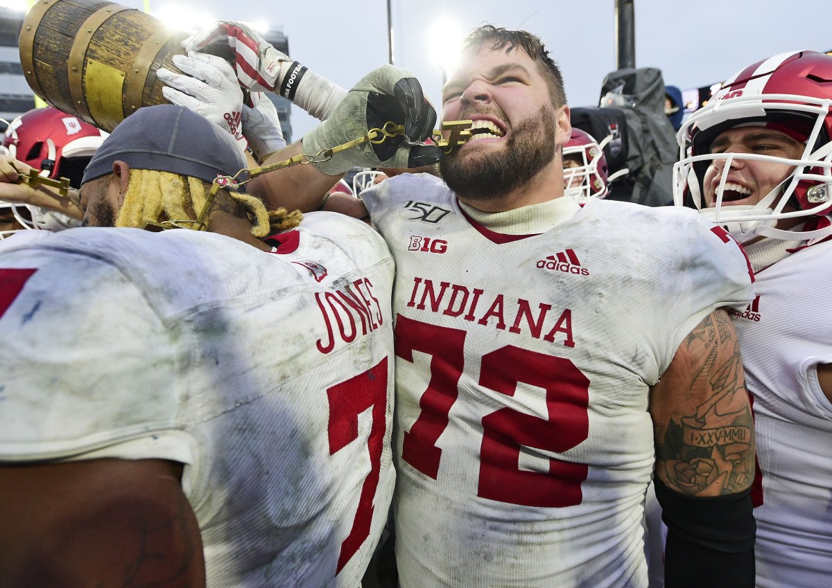 Indiana offfensive guard Simon Stepaniak celebrates with his teammates after beating Purdue to win the Old Oaken Bucket on Nov. 30. It turned out to be his last game as a Hoosier after getting injured in a bowl practice. (USA TODAY Sports)