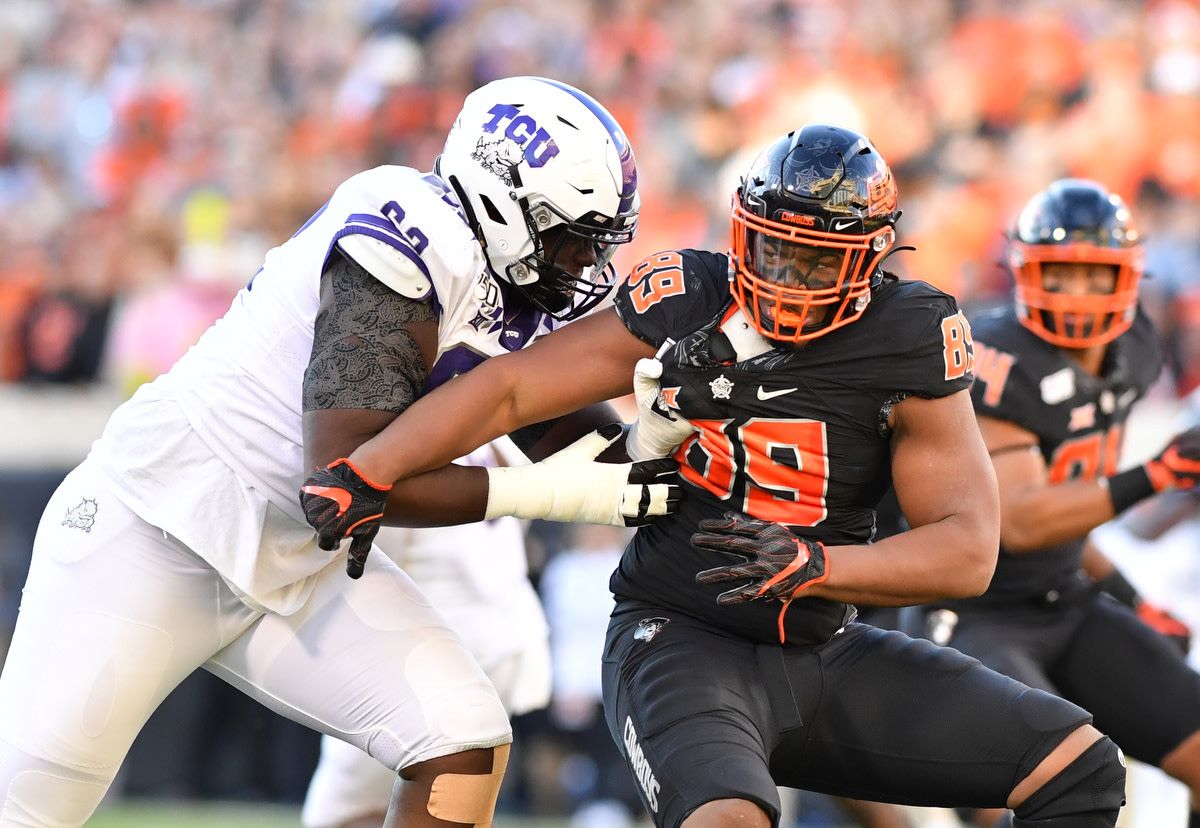 Tyler Lacy battling one of TCU's mammoth offensive tackles.