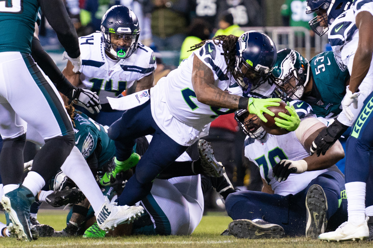 Seattle Seahawks running back Marshawn Lynch (24) scores a touchdown against the Philadelphia Eagles during the second quarter in a NFC Wild Card playoff football game at Lincoln Financial Field.