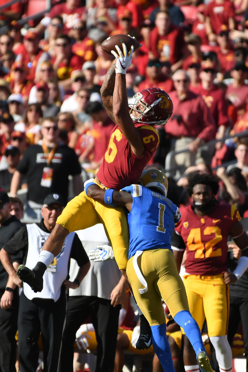 Nov 23, 2019; Los Angeles, CA, USA; Southern California Trojans wide receiver Michael Pittman Jr. (6) makes a catch while UCLA Bruins defensive back Darnay Holmes (1) defends during the first half at Los Angeles Memorial Coliseum. Mandatory Credit: Richard Mackson-USA TODAY Sports