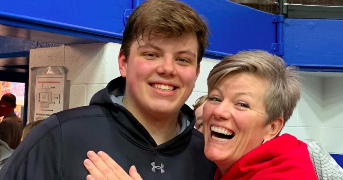 East Central's Luke Collinsworth celebrates with his mother after the shocking upset of Bloomington North in the sectional semifinal Friday night.