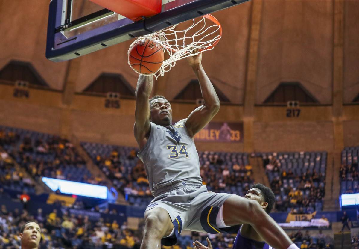 West Virginia Mountaineers forward Oscar Tshiebwe (34) dunks the ball during the second half against the TCU Horned Frogs at WVU Coliseum.