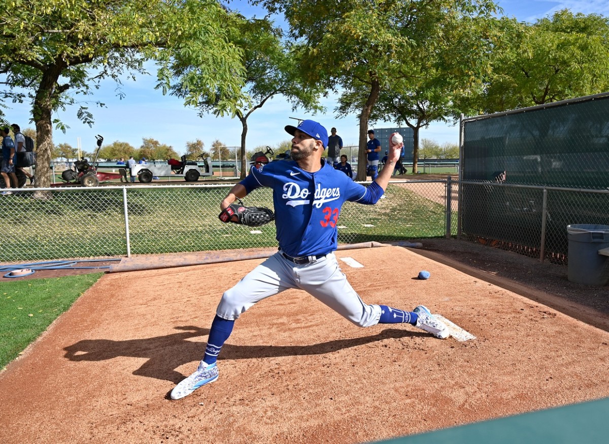 Feb 21, 2020; Glendale, Arizona, USA; Los Angeles Dodgers starting pitcher David Price (33) warms up before throwing live batting practice during spring training at Camelback Ranch. Mandatory Credit: Jayne Kamin-Oncea-USA TODAY Sports